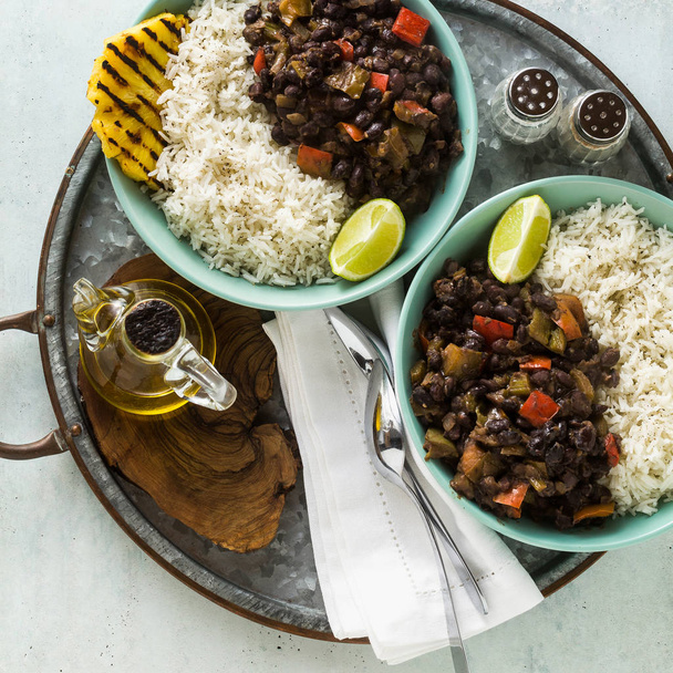 Cuban rice and black bean dish with grilled pineapple. Healthy Vegan Caribbean food for the whole family, party or restaurant menu - Fotoğraf, Görsel