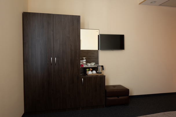 hotel room interior with wardrobe and mirror - Φωτογραφία, εικόνα