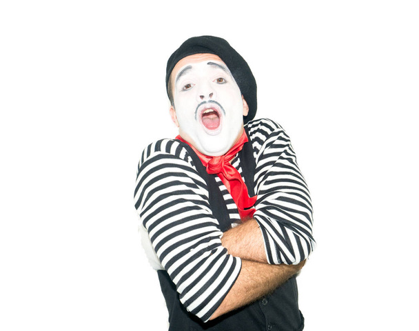 photo of mime which hugging himself and open mouth. isolated on white background - Foto, immagini