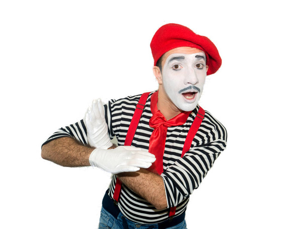 Smiling mime holds his palms like an bird, Isolated on white background - Фото, зображення