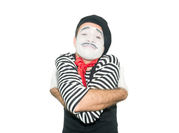 happy mime hugging himself. isolated on white background - Foto, imagen
