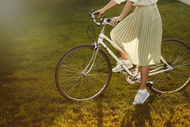 portrait of pretty sexy girl  posing with vintage  retro bicycle  - Фото, изображение