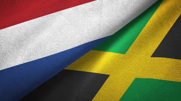 Netherlands and Jamaica flags together relations textile cloth, fabric texture - Photo, Image