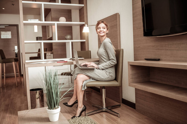 Businesswoman working in cozy spacious hotel room - Photo, image