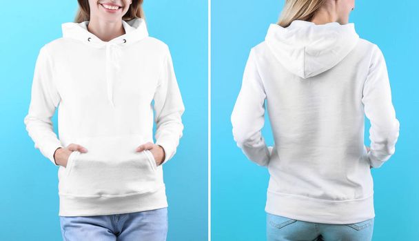 Woman in blank hoodie sweater on color background, closeup. Mock up for desing - Фото, зображення