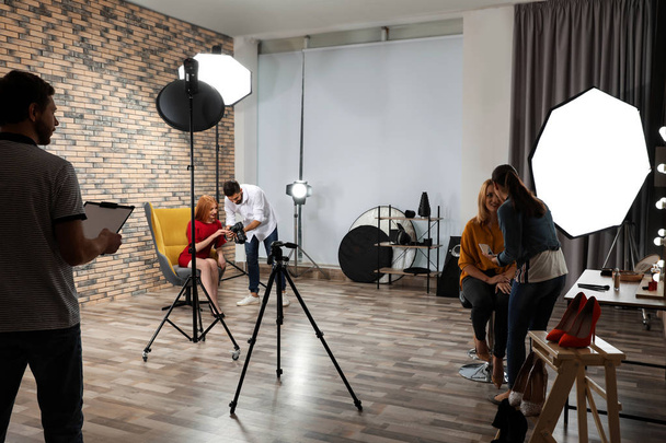 Photo studio with professional equipment and team of workers - Valokuva, kuva