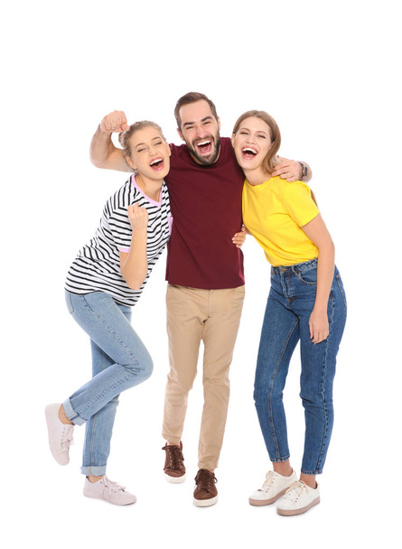 Young people celebrating victory on white background - Foto, immagini