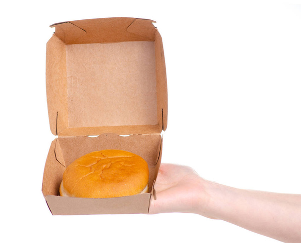 Burger buns burger box in hand - Фото, изображение