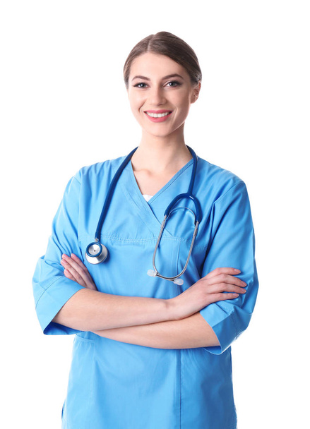 Young medical student in uniform on white background - Foto, Imagem
