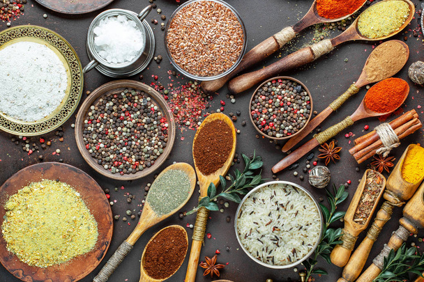 Spices and seasonings for cooking in the composition on the table - Photo, Image