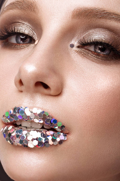 Beautiful girl with creative glitter make up lips. Beauty face. - Foto, afbeelding