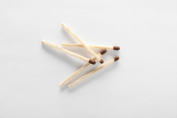 Wooden matches on white background, top view - Foto, immagini