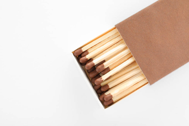Cardboard box with matches on white background, top view. Space for design - Photo, Image