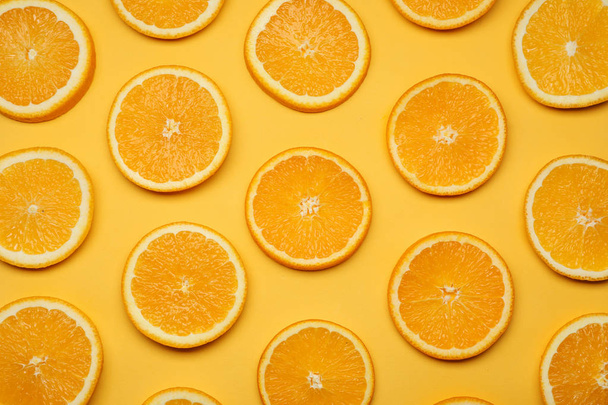 Fresh orange slices on color background, top view - Фото, изображение