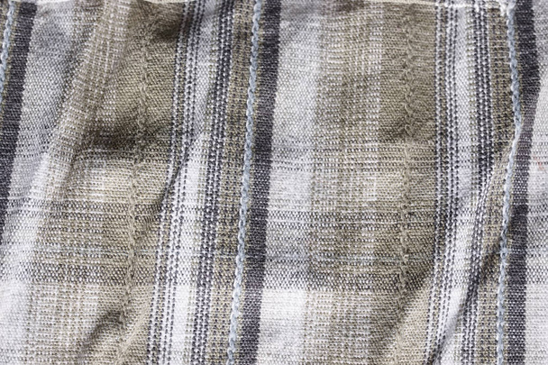 Close up part of a shirt from hemp fabric. Casual man's shirt with pattern. Wrinkled texture from hemp and cotton background - Photo, Image