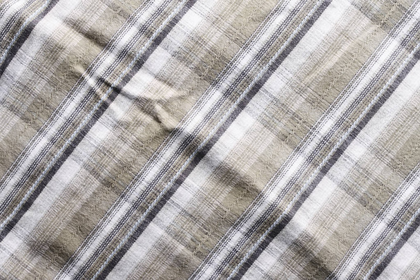 Close up part of a shirt from hemp fabric. Casual man's shirt with pattern. Wrinkled texture from hemp and cotton background - Photo, Image