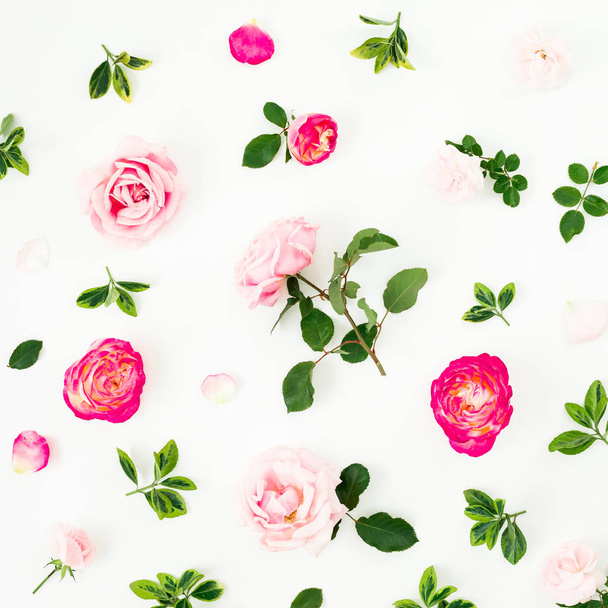 Pastel pink roses flowers and green leaves on white background. Flat lay, top view pattern - Zdjęcie, obraz