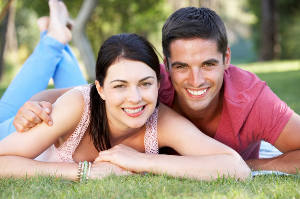 Couple Relaxing In Park Together - Foto, Imagen