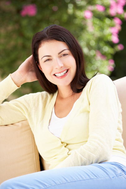 Woman Relaxing On Sofa At Home - Foto, imagen