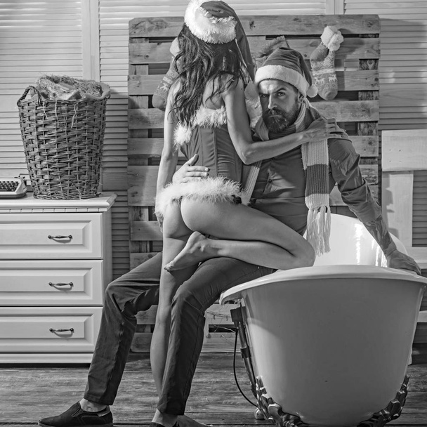 Christmas man and woman couple in bath. - Фото, зображення
