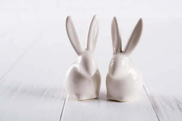 Two little easter bunny. One color minimal concept on white background - Фото, изображение