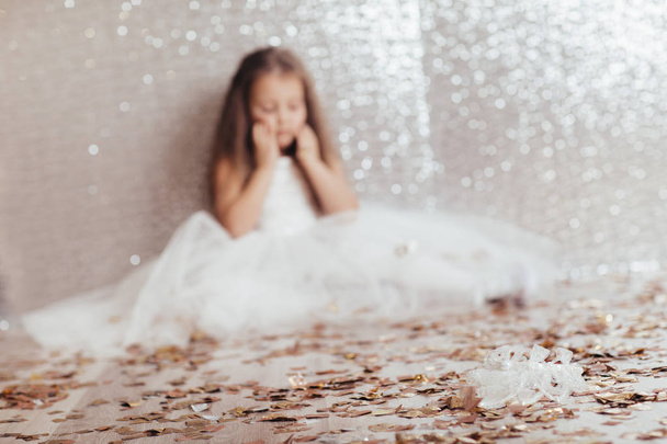 little child girl in princess dress on confetti background - Photo, Image