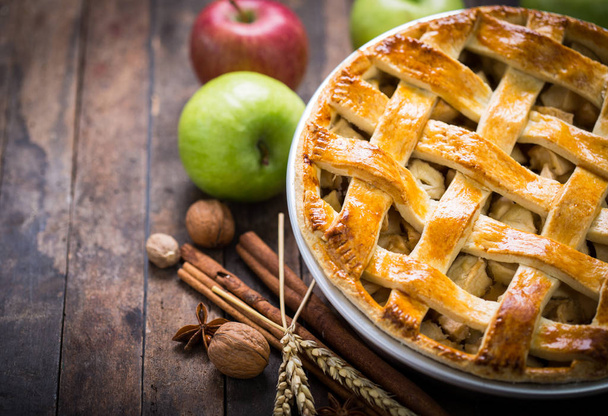 close up view of homemade pie with apples on wooden background - Valokuva, kuva