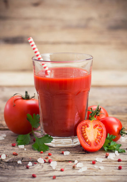 close up view of healthy tomato juice on wooden backdrop - Valokuva, kuva