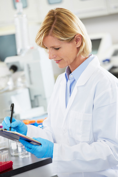 Female Scientist Working In Laboratory - Фото, изображение