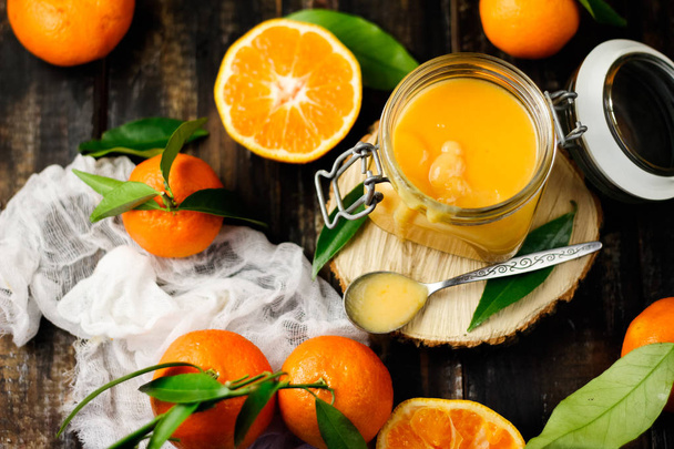 mandarin cream curd in glass jar, selective focus - Фото, зображення
