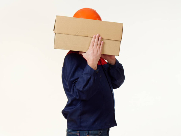 man holds in his hands a big box on a white background 5 - Photo, Image