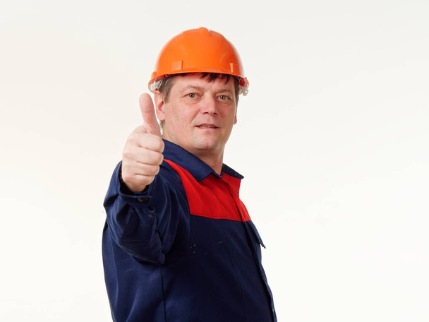 man in builder overalls on white background 5 - Photo, Image