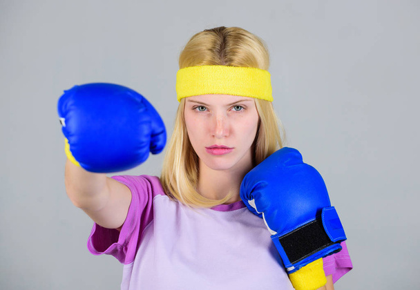 Femininity and strength balance. Woman boxing gloves enjoy workout. Girl learn how defend herself. Woman exercising with boxing gloves. Boxing sport concept. Cardio boxing exercises to lose weight - Photo, Image