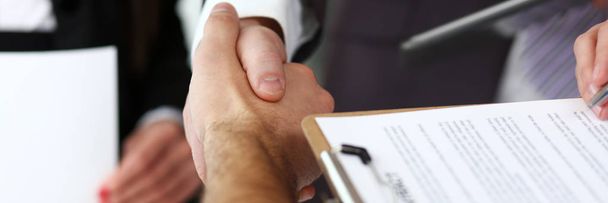 Man in suit and tie give hand as hello in office closeup - Photo, Image