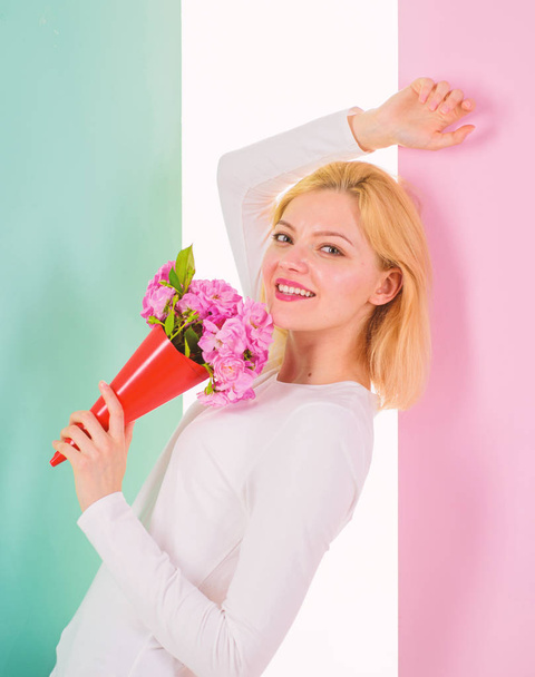 Lady happy received flowers from secret admirer. Woman smiling dreamy try guess who fall in love with her. Girl hold bouquet flowers enjoy fragrance and feels admired. Who is her secret admire - Fotoğraf, Görsel