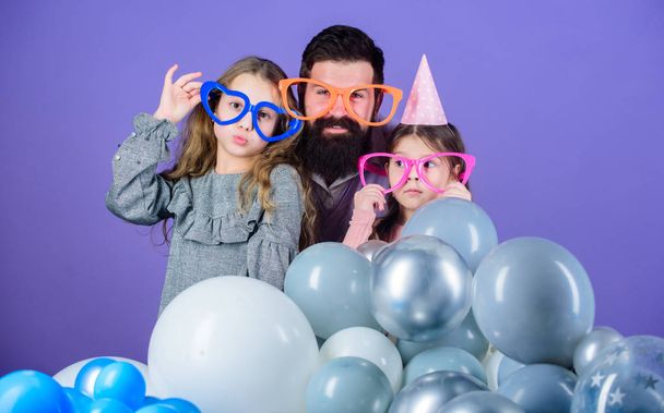 Best dad ever. Friendly family wear funny party accessories. Fathers day. Daughters need father actively interested in life. Birthday party. Father with two daughters having fun. Fatherhood concept - Фото, зображення