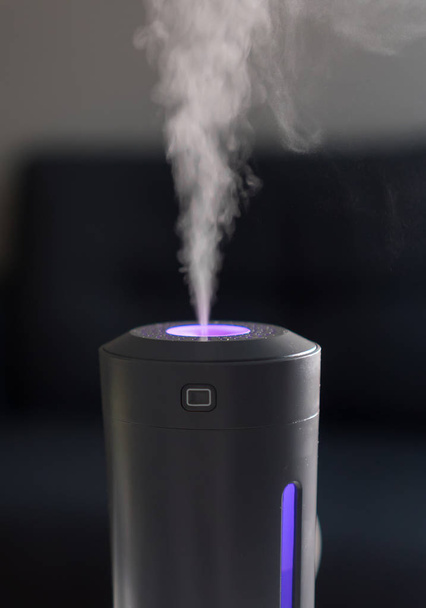 Vapor coming from electric air humidifier. - Photo, Image