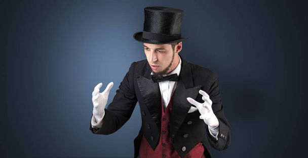 Magician holds something invisible  - Foto, afbeelding