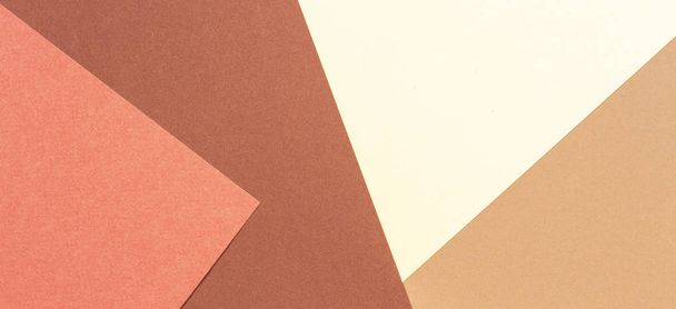 Abstract geometric paper texture cardboard background. Brown, beige, coral, yellow pastel trendy colors - Foto, afbeelding