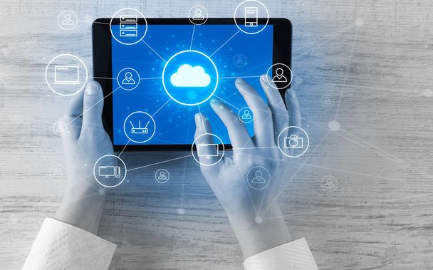 Hand using tablet with centralized cloud computing system concept - Fotoğraf, Görsel