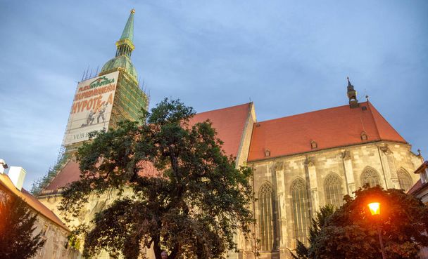 BRATISLAVA, SLOVAKIA - JULY 2011: Cathedral at night in the city center. Bratislava attracts 1 million tourists annually. - 写真・画像