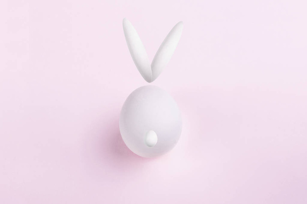 illustration of easter rabbit made of eggs on a soft pink background, happy easter bunny - 写真・画像