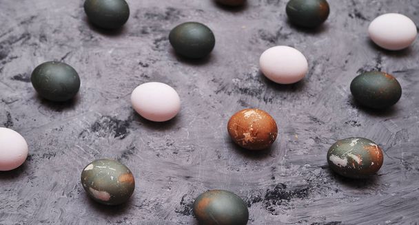 Painted eggs on stone background. - Foto, Imagen