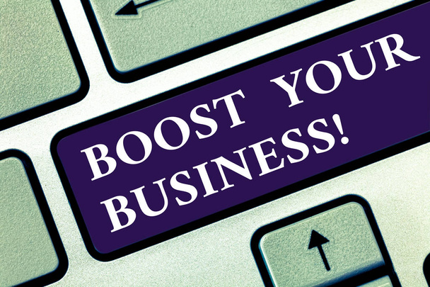 Text sign showing Boost Your Business. Conceptual photo improving some measure of enterprises success Growth Keyboard key Intention to create computer message pressing keypad idea. - Foto, Bild
