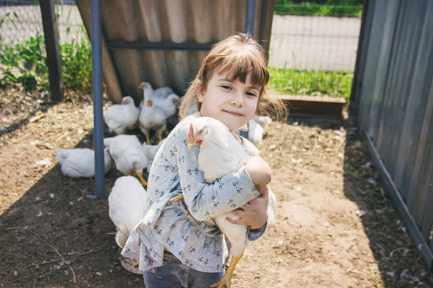 Bio chickens on a home farm a children. nature. - Foto, imagen