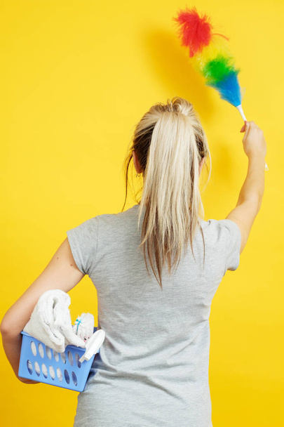 dust cleaning woman backview feather duster cloths - Fotografie, Obrázek