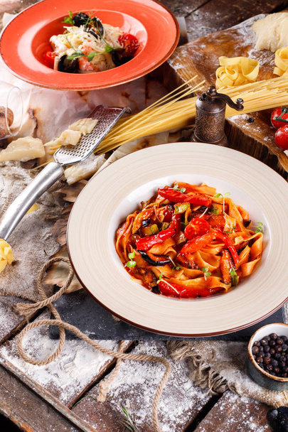 Pasta with fresh seafood and spaghetti with tomato sauce, Ingredients for cooking, Tomatoes, pasta - Φωτογραφία, εικόνα