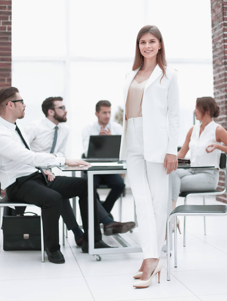 young business woman standing near desktop - Photo, Image