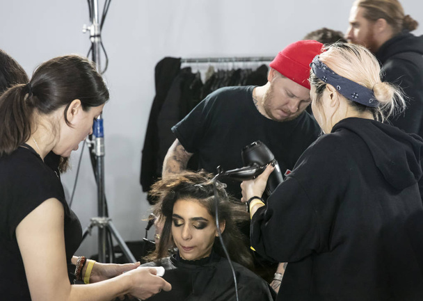 New York, NY - February 13, 2019: A model prepares backstage for the Boss Fall Winter 2019 fashion show during New York Fashion Week - Foto, Imagen