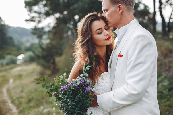 Beautiful wedding couple in a summer field - Photo, image